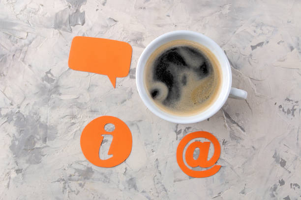 istock client support service. Contact us for feedback. work desk with a cup of coffee and various feedback icons. 1328476794