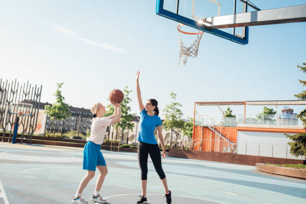 istock Girls playing basketball one on one 1328478301