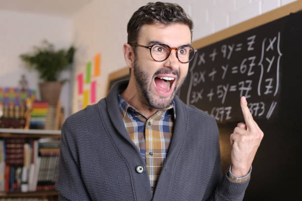 сердитый учитель математики показывает средний палец - rudeness teacher training humor стоковые фото и изображения