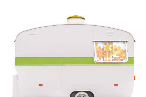 istock Vintage caravan with flower curtain isolated on a white background 1328483667
