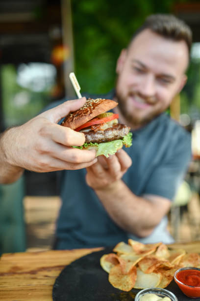 Woman holding a hamburger
