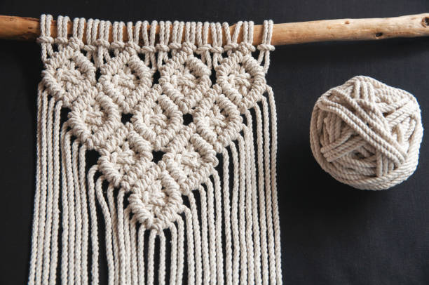 istock Natural  handmade stylish cotton macrame decoration, hobby interior for hanging on wall. 1328486947
