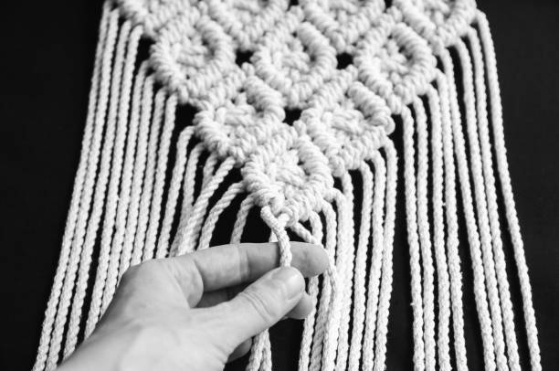 istock Decorative handmade stylish cotton macrame decoration, hobby interior for hanging on wall. 1328486949