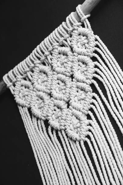 Decorative handmade stylish cotton macrame decoration, hobby interior for hanging on wall.