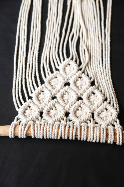 istock Decorative handmade stylish cotton macrame decoration, hobby interior for hanging on wall. 1328486951