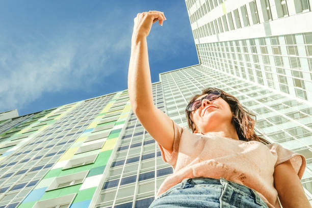 istock Portrait woman with mobile phone, bottom view. 1328488330
