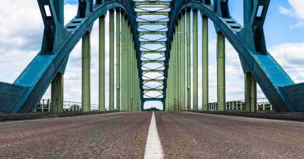 Old IJsselbrug over the river IJssel between Zwolle and Hattem Old IJsselbrug over the river IJssel between Zwolle and Hattem. View from the middle of the road on the old steel arch bridge. ijssel stock pictures, royalty-free photos & images