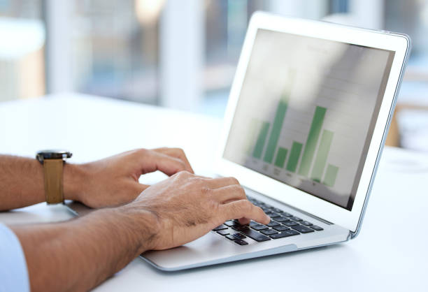 istock Shot of a businessman using a laptop at work 1328492625