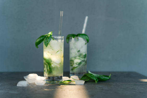 istock Refreshing summer cocktails with gin tonic, cucumber and basil 1328493546