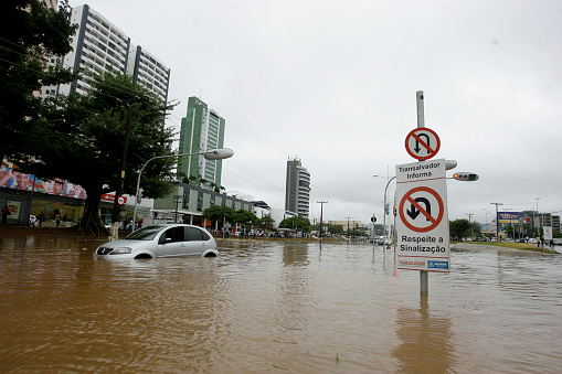 salvador, bahia, brazil - april 19, 2015: vehicle is seen in flooded area with rainwater on a street in Salvador city.