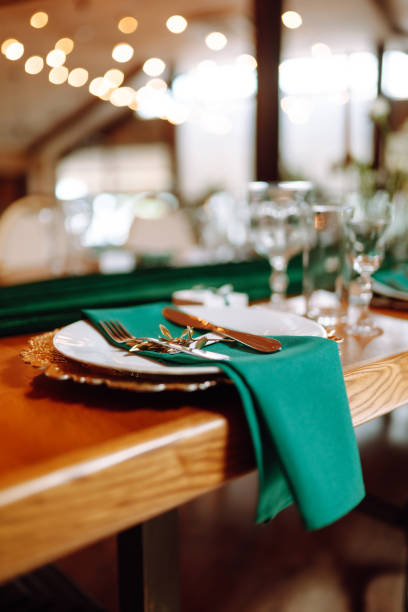 istock Wedding. Banquet. Beautiful table setting for a party, wedding reception or other festive event emerald colour. 1328496548