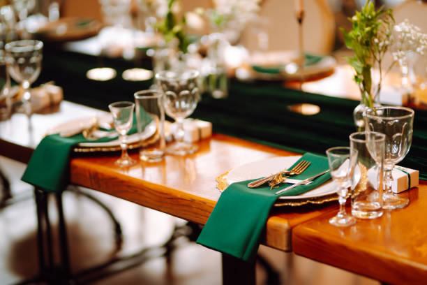 istock Wedding. Banquet. Beautiful table setting for a party, wedding reception or other festive event emerald colour. 1328496568