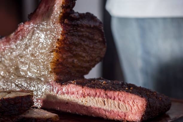 istock sliced brisket on a wooden board with copy space and light light 1328496606