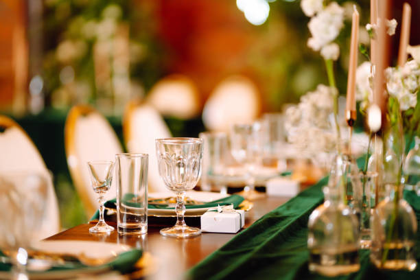 istock Wedding. Banquet. Beautiful table setting for a party, wedding reception or other festive event emerald colour. 1328496612