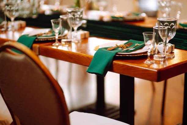 istock Wedding. Banquet. Beautiful table setting for a party, wedding reception or other festive event emerald colour. 1328496620