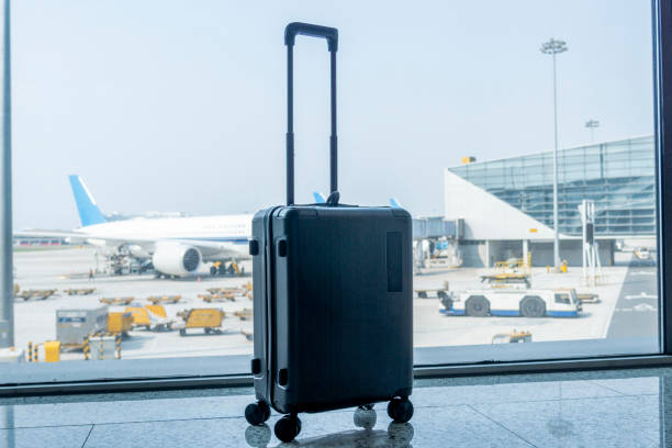 istock A black suitcase in the airport terminal 1328496739