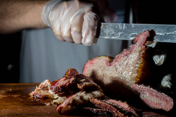 istock sliced brisket on a wooden board with copy space and light light 1328496745