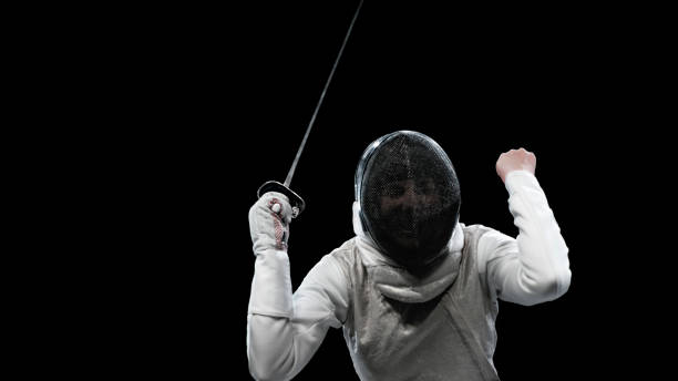 istock Female fencing athlete celebrating victory . 1328496802