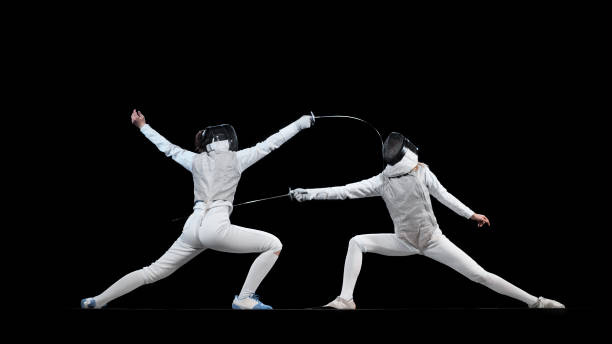 istock Female fencing athletes competing . 1328496804