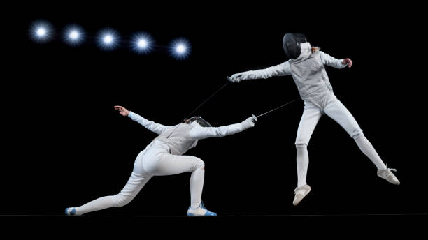 istock Female fencing athletes competing . 1328496807