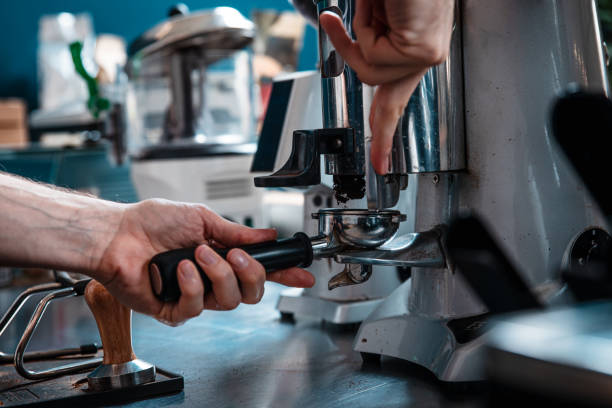 istock Close up of barista hands preparing cappuccino. 1328499521