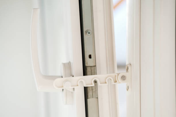 istock Open white PVC window with a fixing device for ventilation. Close-up. 1328502029