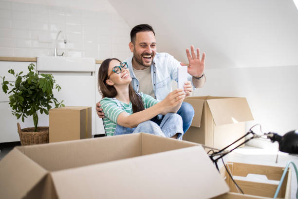 istock Happy couple making a video call while moving in 1328503388