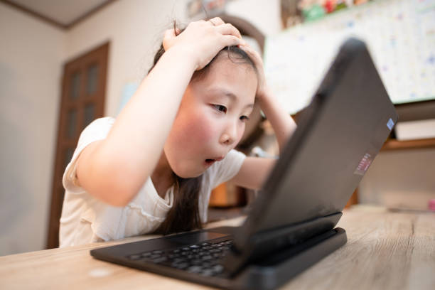 istock girl surprised to see a laptop computer 1328505921