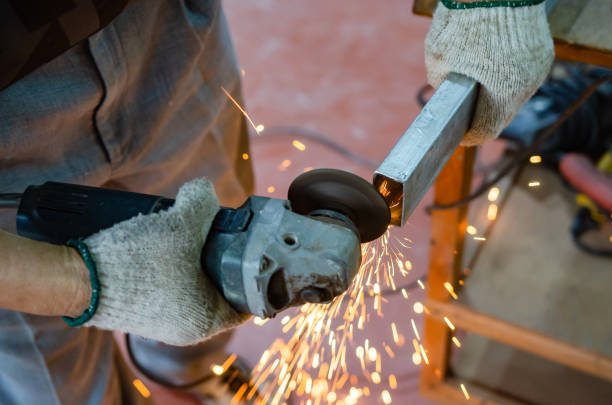 istock Craftsman working on steel at a construction site, soft focus 1328507722