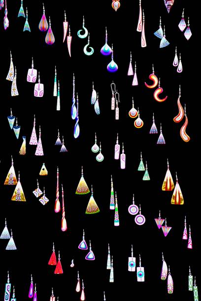colorful various earrings on black background .bazaar sale.