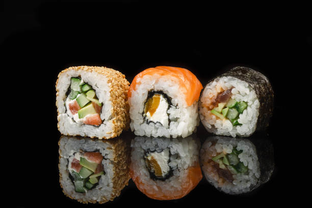 istock Set of sushi and maki rolls on the glass table 1328511382