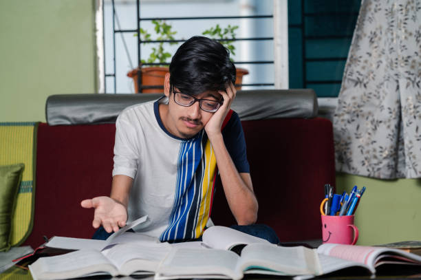 istock Young boy preparing for exam, Studying  online at home. 1328512015