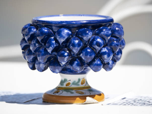 istock sicilian ceramic cup of caltagirone town on a table 1328512161
