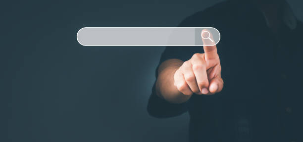 istock The man point to the sign of the Search Engine Optimization SEO Networking Concept.Searching Browser of Internet Data Information with the blank search bar. 1328512824