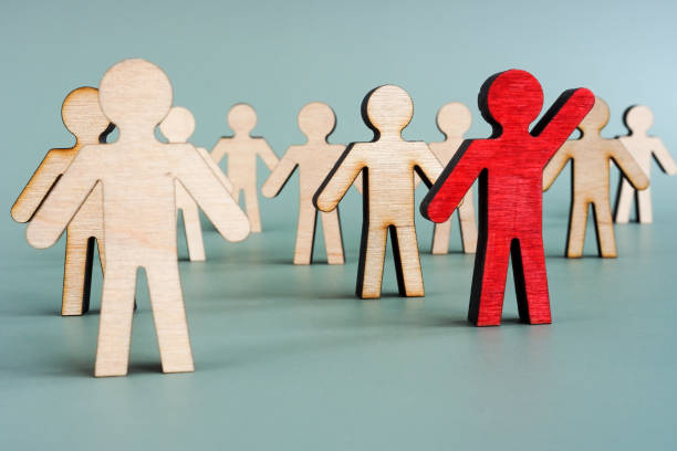 istock Red wooden figure in the crowd. Leadership development concept. 1328513822