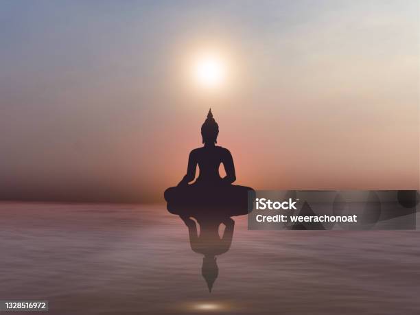 Silhouette Of Buddha Statue On Golden Sunset At River Buddhism Background Stock Photo - Download Image Now