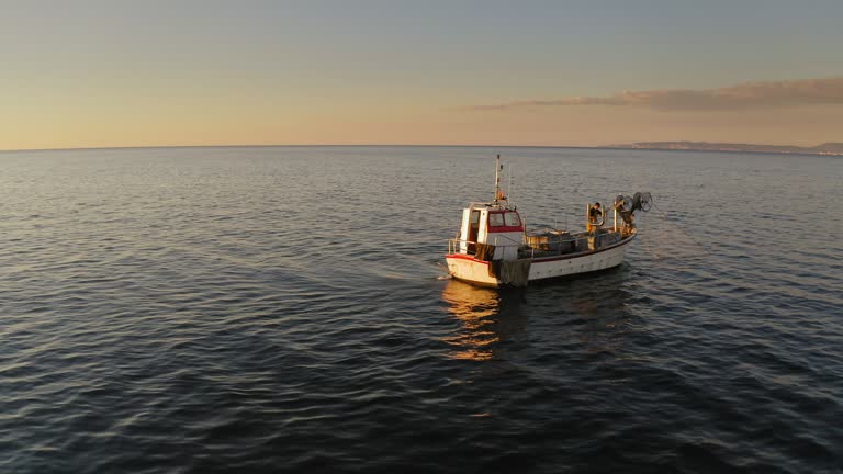 Independent Fisherman Hauling In Morning Catch