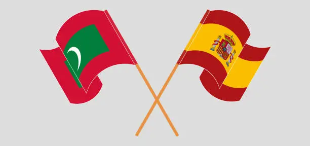 Vector illustration of Crossed and waving flags of Maldives and Spain