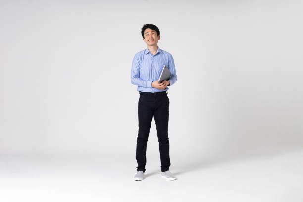 istock Full-length portrait of an Asian man on a white background. 1328519528