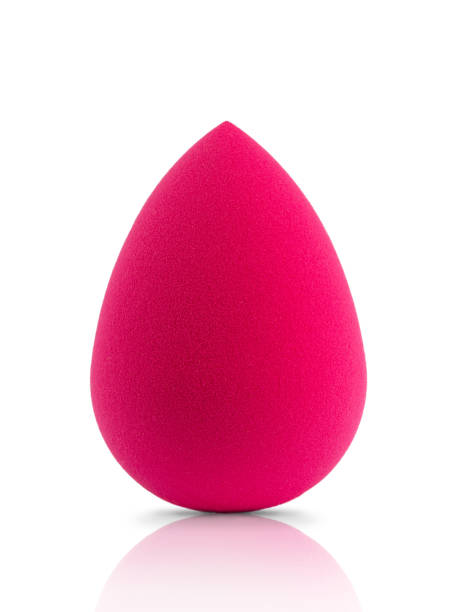 istock sponge for applying foundation to the skin, isolate with a reflection on a white background 1328519787