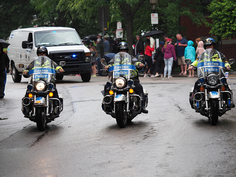 Boston, USA - June 16, 2019: Image of Boston Police officers riding Harley-Davidson motorcycles during the Bunker Hill Day Parade in Boston.