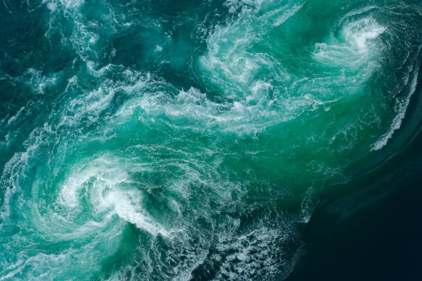 tidal swirl at saltstraumen maelstrom in northern norway - tide imagens e fotografias de stock