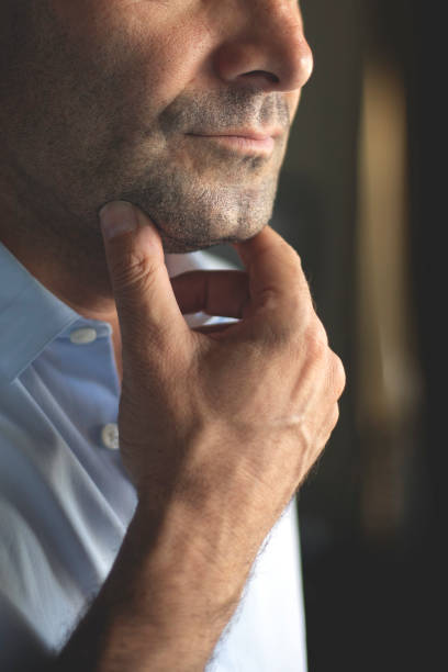 close-up portrait of a caucasian man with a dimpled chin - dimple imagens e fotografias de stock