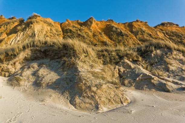 The Sylt red cliff is called so because at sunset the sun turns the color of the cliff into a strong red. Therefore the cliff is very famous for taking photos at sunset. But there are good reason do so also during the day.
