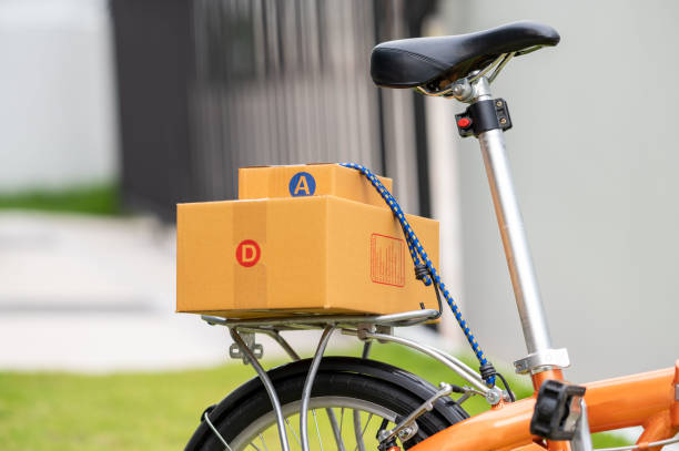 istock Closeup Delivered package parcels box on bicycle outdoors to deliver. 1328521376