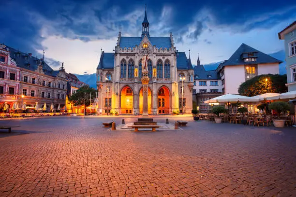Cityscape image of old town Erfurt, Thuringia, Germany with the neo-Gothic Town Hall on Fischmarkt square at sunrise.