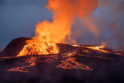 Beautiful aerial view of an Active Volcano with exploding red Lava in Iceland