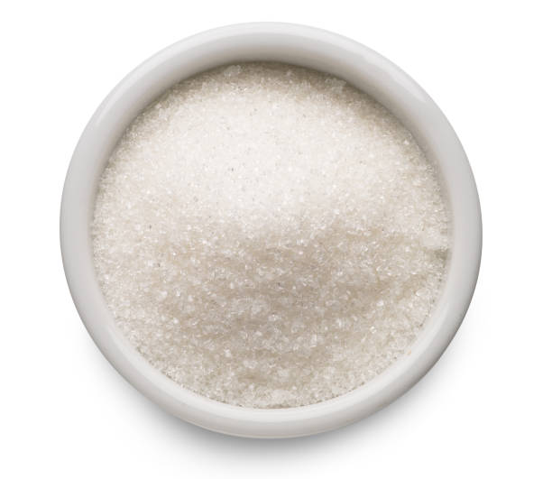 istock White refined sugar in ceramic bowl on white background. Top view. File contains clipping path. 1328528361