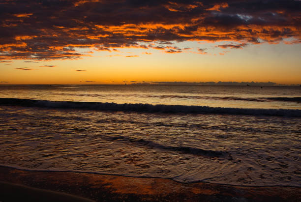 istock Cloudy sunrise on a beach in Benicasim 1328528404