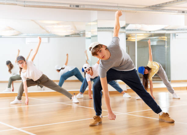 istock Teenagers training hip hop in dance studio 1328530996